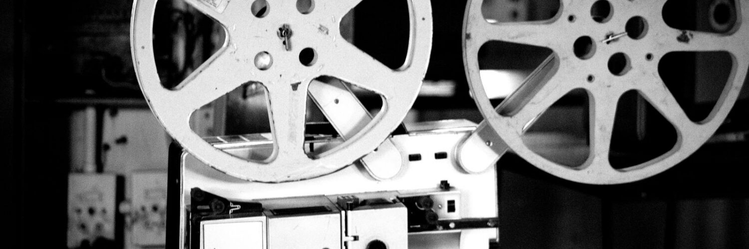 Black and white photo of a vintage film projector