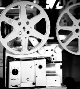 Black and white photo of a vintage film projector