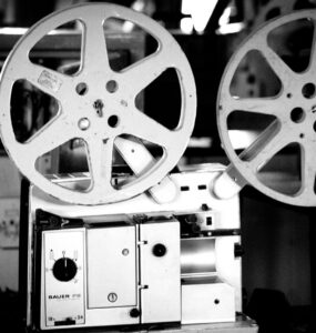Black and white photo of a vintage film projector