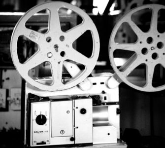 Black and white photo of a vintage film projector