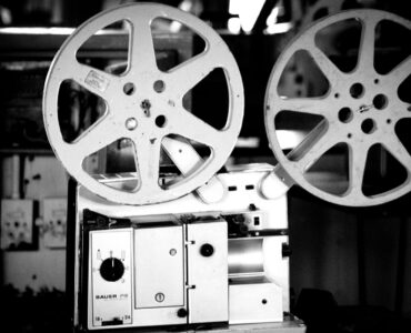 Black and white photo of a vintage film projector