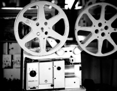 Black and white photo of a vintage film projector